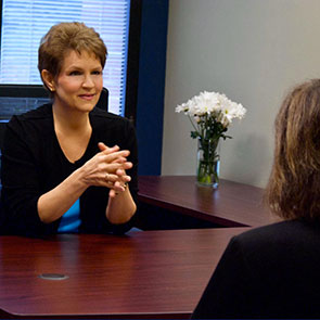 Brenda Bence at a desk